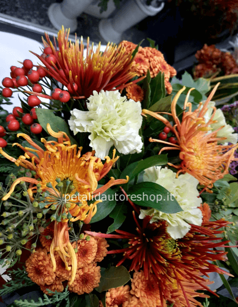 Composizione in spugna rotonda con crisantemi